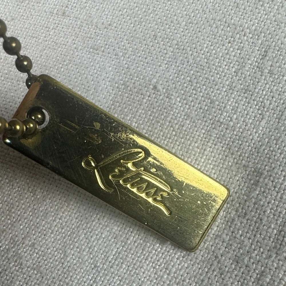 Letisse double sided gold bag charm tag